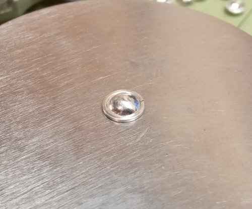 Judy Larson's Domed Stud with Drop Loop - , Metalwork, Cutting, Cutting Tool, Cutters, How To Punch Holes, Hole Punching, Punch A Hole, Stamping, Stamps, Butane Torch, Soldering, Solder, Place a domed disc on a bench block.